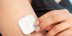 Lady with NRT patch on right arm