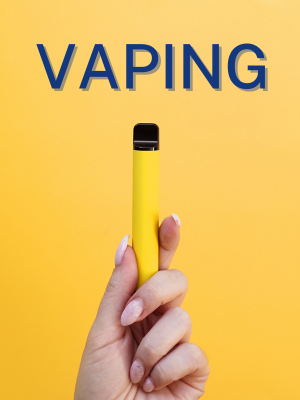 hand holding vape on yellow background