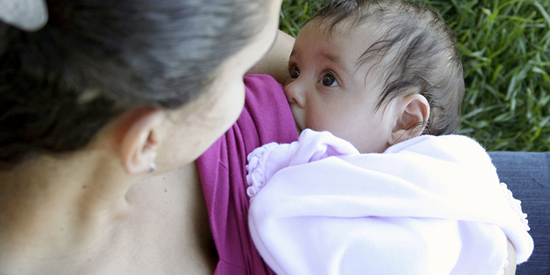 baby feeding at mother's breast