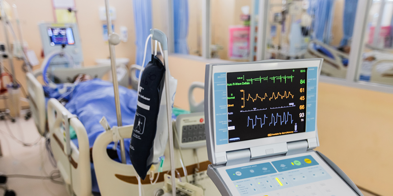 Medical equipment surrounding a hospital bed