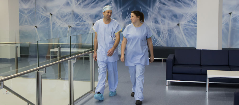 Photo of two surgeons walking though Wollongong Hospital