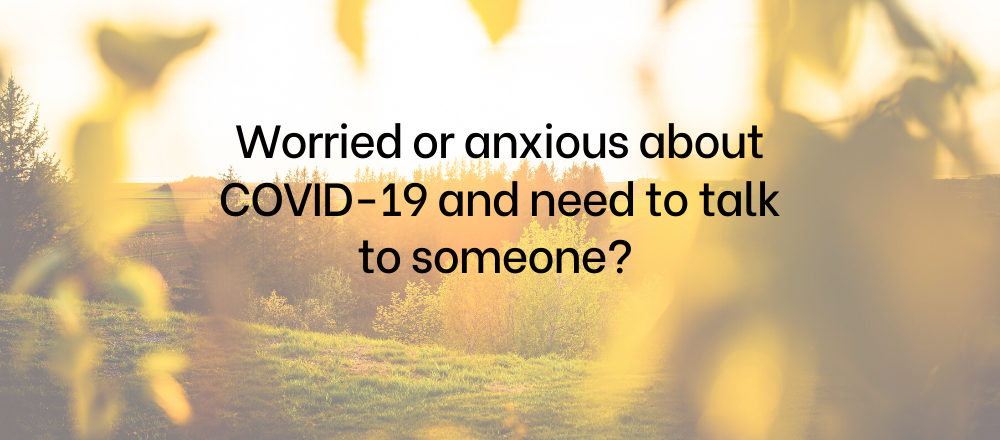 Scenic background with the words worried or anxious about COVID-19 and need to talk to someone?