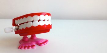 Wind up denture toy on white table