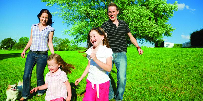 Family playing in a park