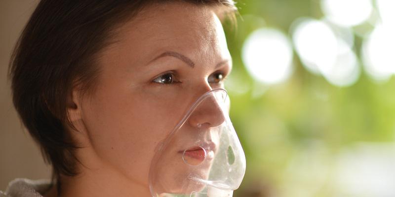 Woman with oxygen mask
