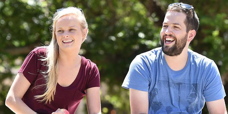 Two people sitting together in a park