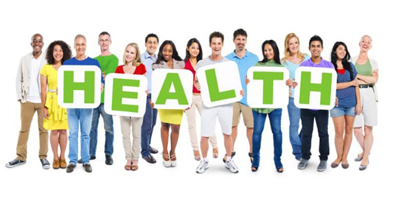 Group of people holding up the letters HEALTH