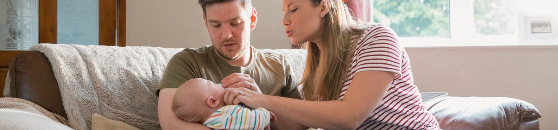 parents soothing new baby